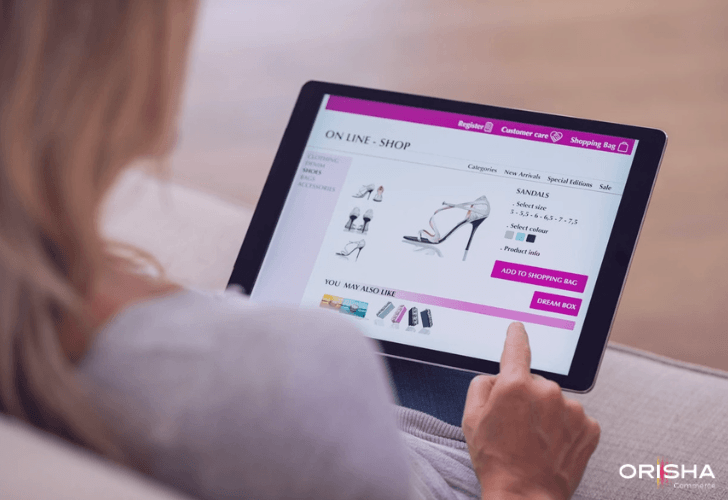 A consumer browsing sandals on a tablet with AI-powered "You may also like" cross-selling recommendations.