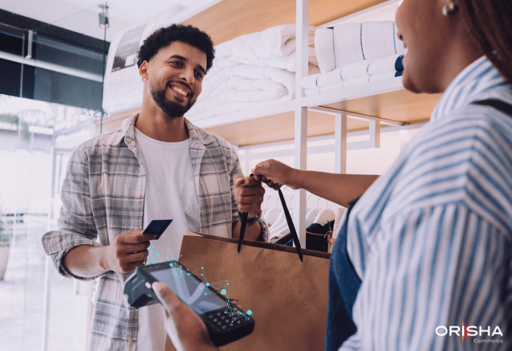 Connected retail associate checking out a customer directly in the store aisle using a mobile point of sale (mPOS) terminal.